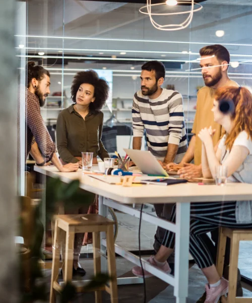 The Wranx team gathered around a table in the Liverpool office, mid-discussion.